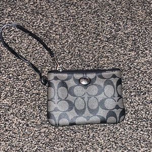 Black and gray leather Coach wristlet